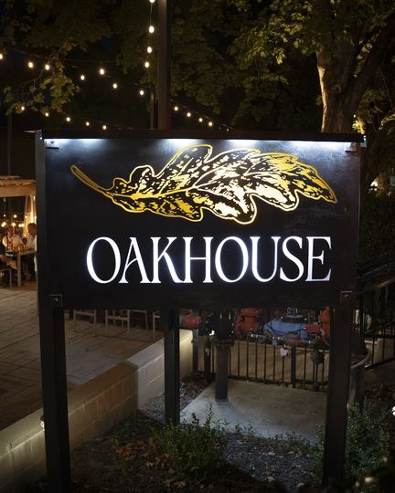 The Oakhouse sign at night