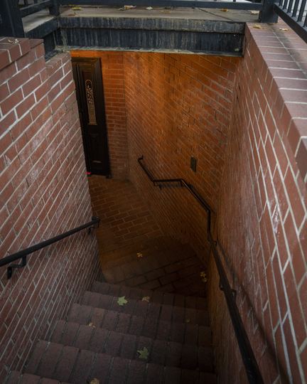 The brick stairwell down to The Lounge